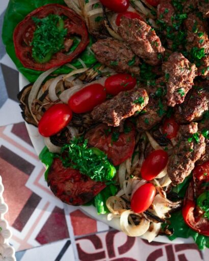 a platter of meat and vegetables on a table